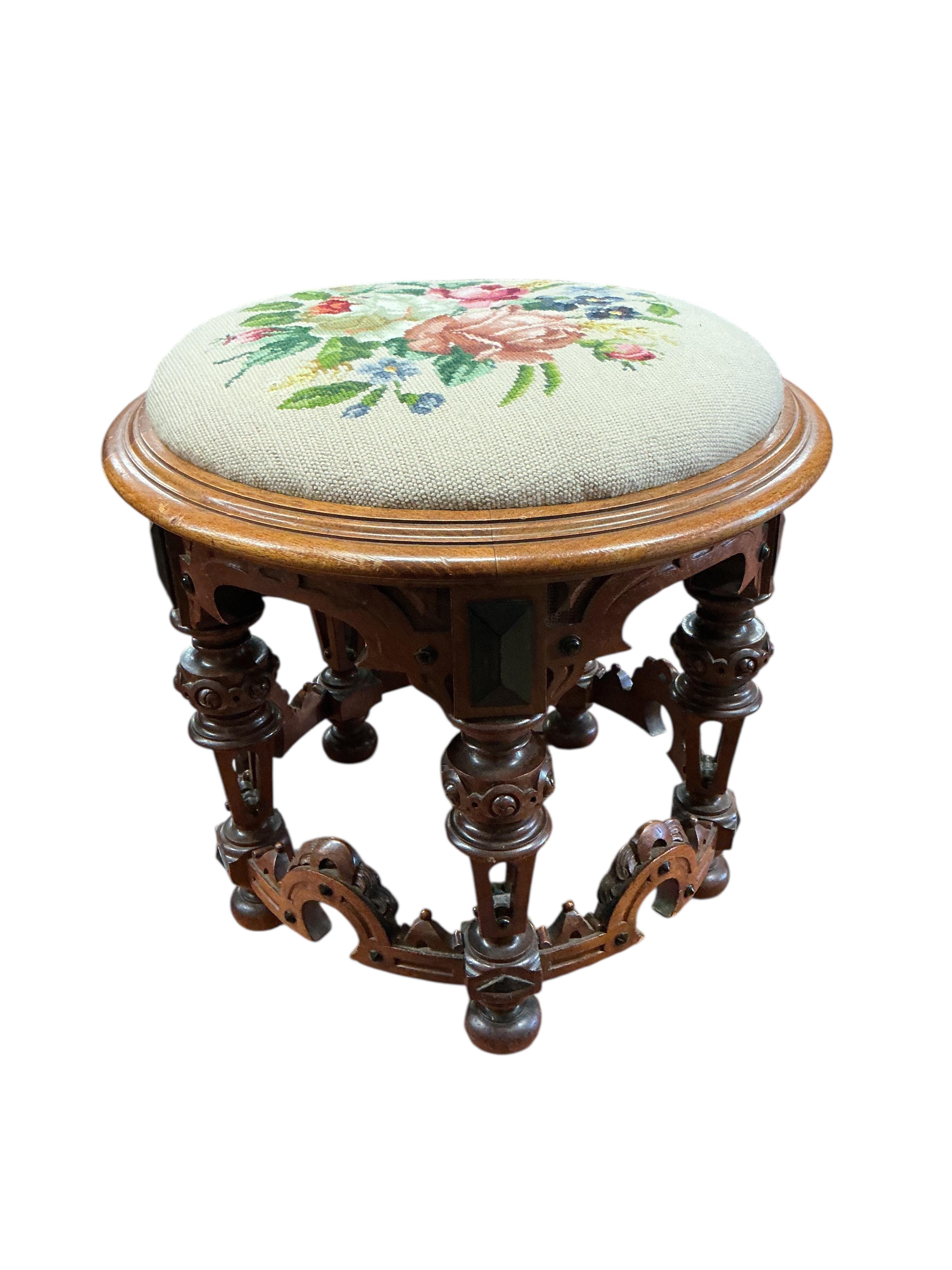 A Victorian circular mahogany stool with drop-in tapestry seat, diameter 48cm, height 44cm
